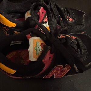 New Balance Sesame Street Kids Black and Orange Sneakers